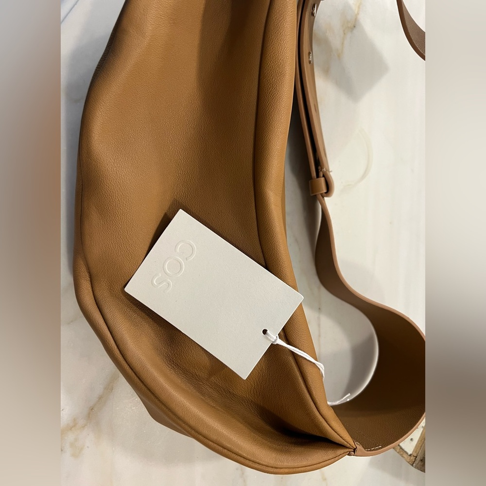 COS camel colored leather sling bag. Cannot get this color anymore
